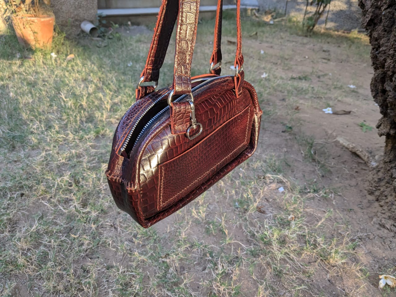 Leather purse presentation board with sketches, reference images, and finished object study
